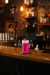 Vibrant Pink Cocktail on Bar Counter