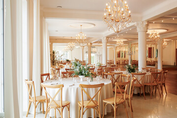 Elegant Banquet Hall with Chandeliers and Floral Decor