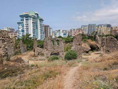 Naula Roman ruins near Alanya, Antalya, Turkey showing modern hotels in the background