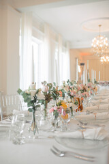 Elegant Wedding Table Setting with Floral Centerpieces