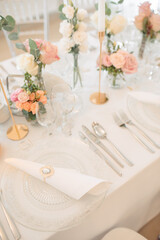 Elegant Wedding Table Setting with Floral Centerpieces