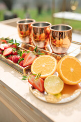 Copper Mugs with Citrus and Strawberries
