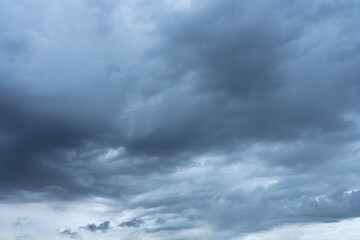 Obraz premium Dramatic gray and dark blue storm clouds fill the sky High resolution image of a cloudy sky