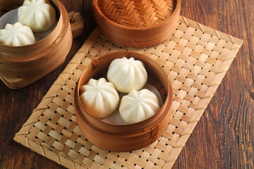 Bakpao Coklat, chinese steamed buns with chocolate paste on bamboo basket
