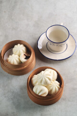 Bakpao Coklat, chinese steamed buns with chocolate paste on bamboo basket
