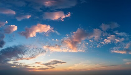 Fototapeta premium a serene sky with a few scattered clouds reflecting the soft colors of dawn the clouds