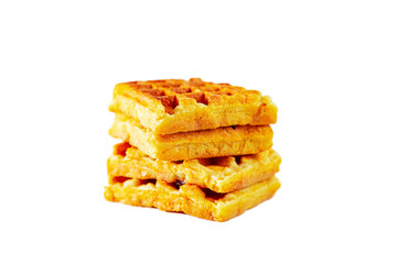 Stack of freshly baked belgian waffles isolated on white background.