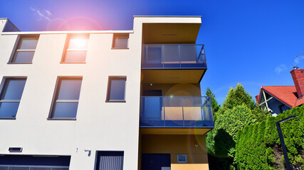 European residential architecture harmonizing with nature. Eco-friendly living in city with greens. Eco apartment building saving energy and fresh air concept. 