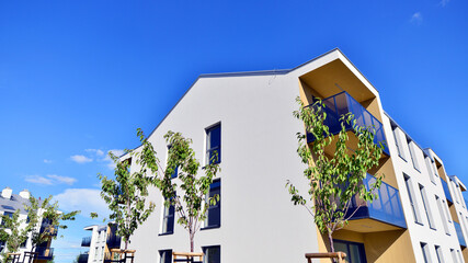 European residential architecture harmonizing with nature. Eco-friendly living in city with greens....