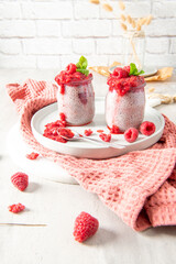 Raspberry chia seed pudding with loose berries