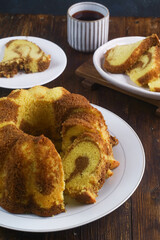 A marble cake is a cake with a streaked or mottled appearance achieved by very lightly blending light and dark batter. Due to its zebra-striped pattern, it is also called zebra cake
