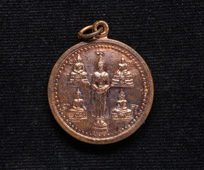 metal amulet coins worshipped by famous monks in thailand