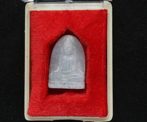 amulets of famous monks are believed in by many people in thailand.