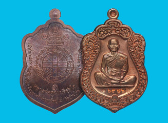 metal amulet coins worshipped by famous monks in thailand