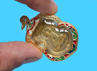 metal amulet coins worshipped by famous monks in thailand