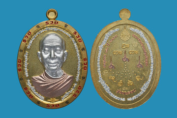 metal amulet coins worshipped by famous monks in thailand
