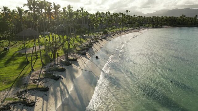 Aerial footage of Playa Aserradero, Dominican Republic &mdash; palm-lined coast and turquoise Caribbean waters. Filmed 27 August 2025, Las Galeras, Dominican Republic