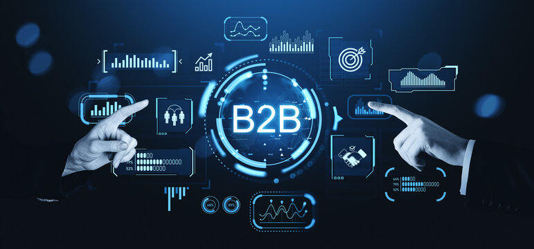 B2B technology interface with data analytics icons, two hands pointing at futuristic digital dashboard concept on dark background.