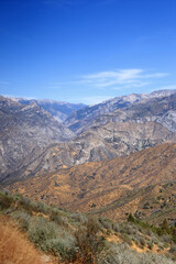 A mountain range in Kings Canyon National Park against a bright blue sky