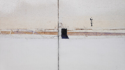 The door's surface has visible remnants of old tape