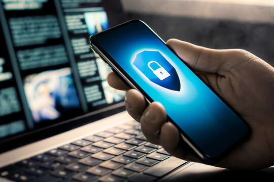 Phone cyber security to protect data from fraud, hacker, identity theft or scam. Online privacy and secure use of smartphone and laptop computer. Spy scammer safety, cybercrime and cybersecurity.