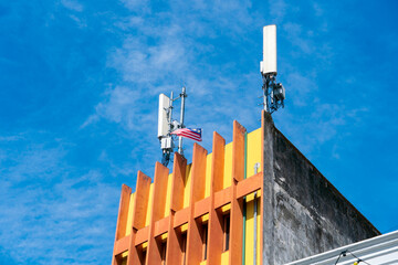 A mobile antenna mounted on a rooftop, providing wireless communication coverage for the surrounding area in urban environments.