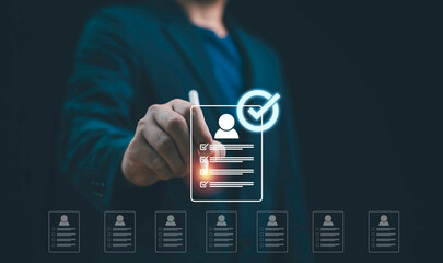 Businessman selecting candidate profile with digital checklist recruitment technology, HR...