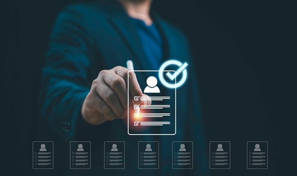Businessman selecting candidate profile with digital checklist recruitment technology, HR management system employee evaluation, hiring process human resources, and online job application.