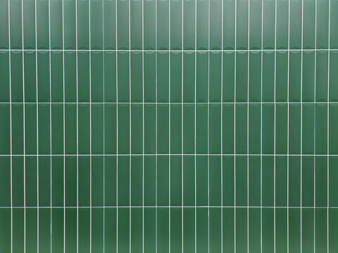 Green tile wall background with clean geometric pattern. Ceramic surface design suitable for interior, bathroom, kitchen, architecture, and decorative concepts.
