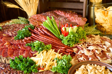 Artisanal charcuterie spread featuring an array of cured meats, cheeses, and fresh garnishes in a rustic setting
