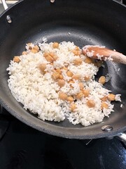 Traditional Rice Pilaf with Chickpeas Cooking in Pan