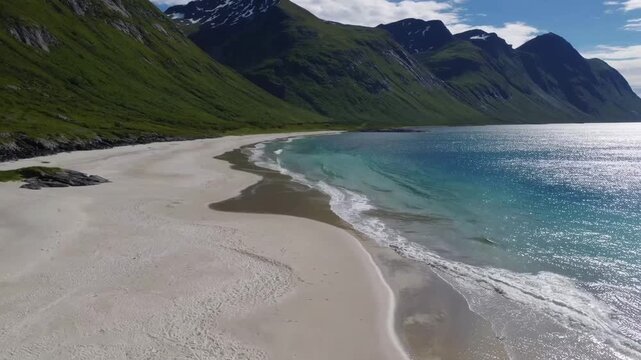 Scenic summer view of beach with mountains and ocean
