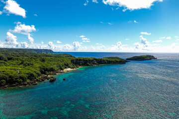 Fototapeta premium Remote Natural Beach and Village Coastline, Nago, Okinawa, Japan （沖縄 名護市 無名の自然海岸と集落の海岸線）
