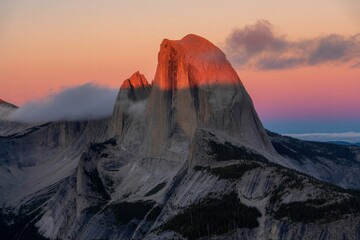 Majestic half dome illuminated by golden hour sunset light in yosemite national park