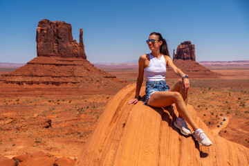 Young Woman in White Shirt and Shorts at Stagecoach Formations in Utah, USA