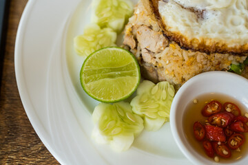 Close up of chilli with fish sauce, slice cucumber, lemon in fried rice meal