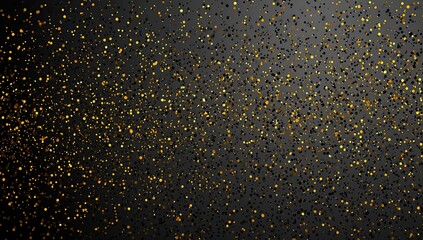 Abstract background of scattered gold glitter on dark gray