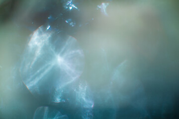 Play of light in dark and bokeh creating abstract background.