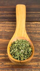 Dried herbs in wooden spoon (1)