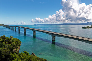 Obraz premium Aerial Drone View of Kouri Bridge (古宇利大橋) Stretching over Emerald Blue Sea, Okinawa, Japan