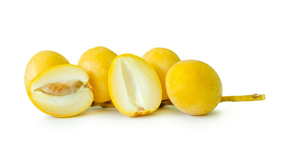 Fresh ripe yellow Barhi date palm fruits in small bunch witth halves in stack isolated on white background with clipping path Concept of iftar food in Ramadan for Muslims