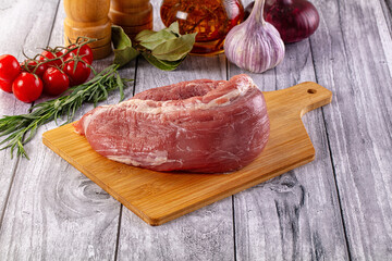 Raw pork sirloing over board