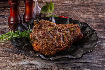 Baked beef steak on the bone