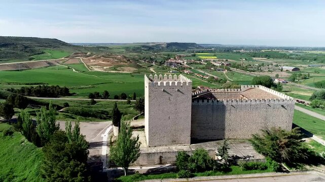 Aerial photo of Monzon de Campos Castle surrounded by green rural fields