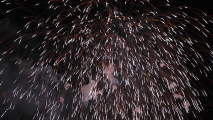 View of the music-synchronized fireworks display on the Rhine in Cologne with the Cologne Lights...
