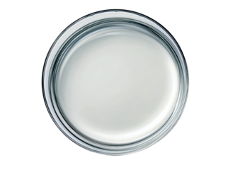 High-angle view of a clear glass circular dish filled with a light, smooth liquid