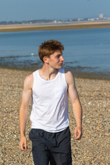 Teenage Boy Walking Beach
