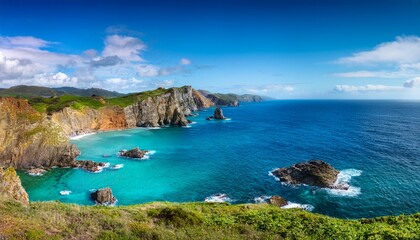 Fototapeta premium serene coastal landscape featuring turquoise waters and rugged cliffs under a bright blue sky