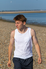 Teenage Boy Walking Beach