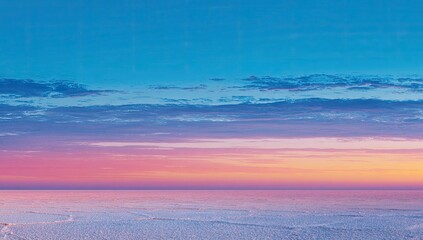 Serene seascape at dawn, pastel hues of pink, orange, and blue paint the sky above a calm ocean, wispy clouds streak across the horizon